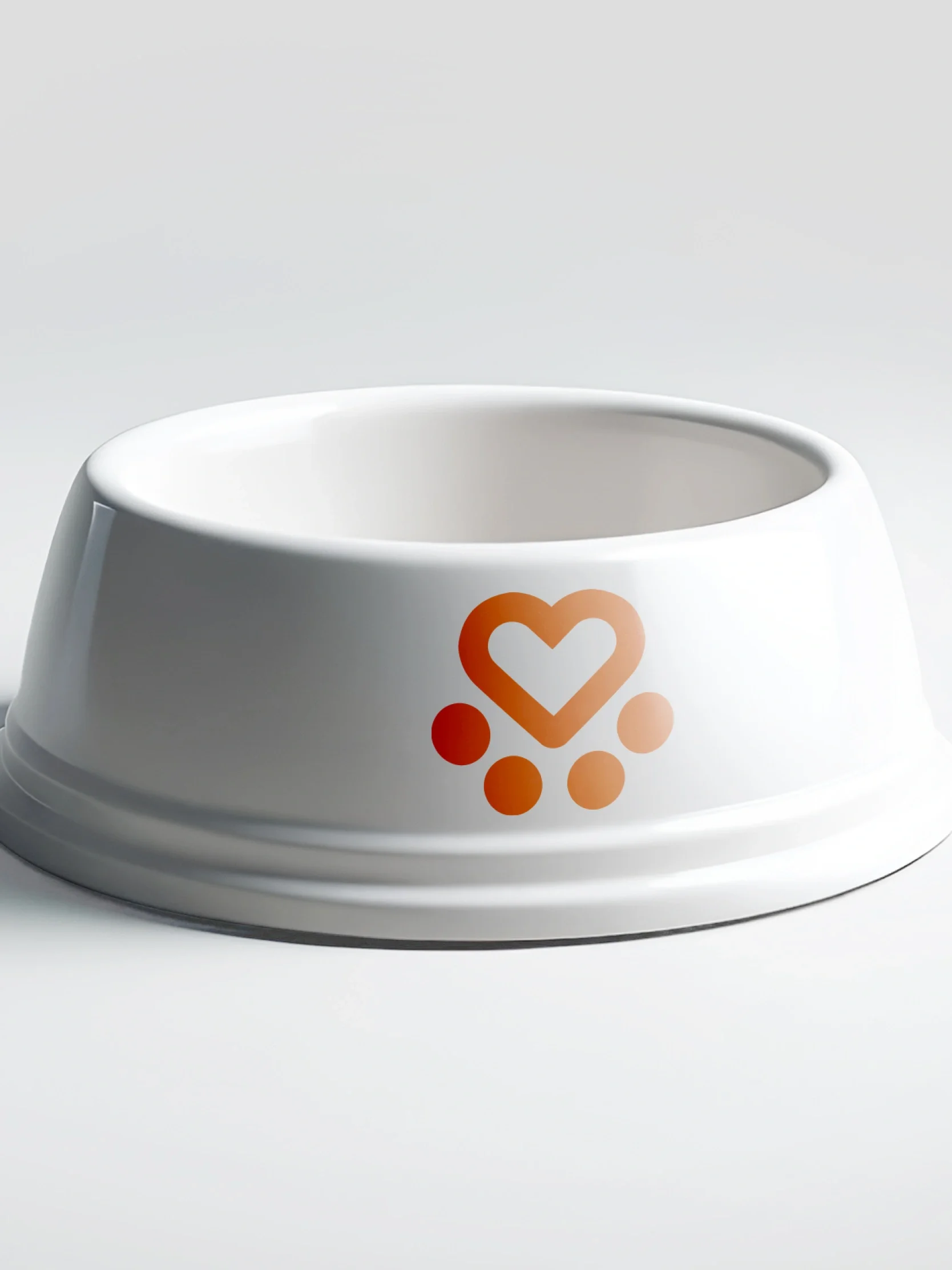 A white pet bowl with an orange heart and paw print, perfect for supporting Spanish Stray Dogs or enhancing your charity brand identity.