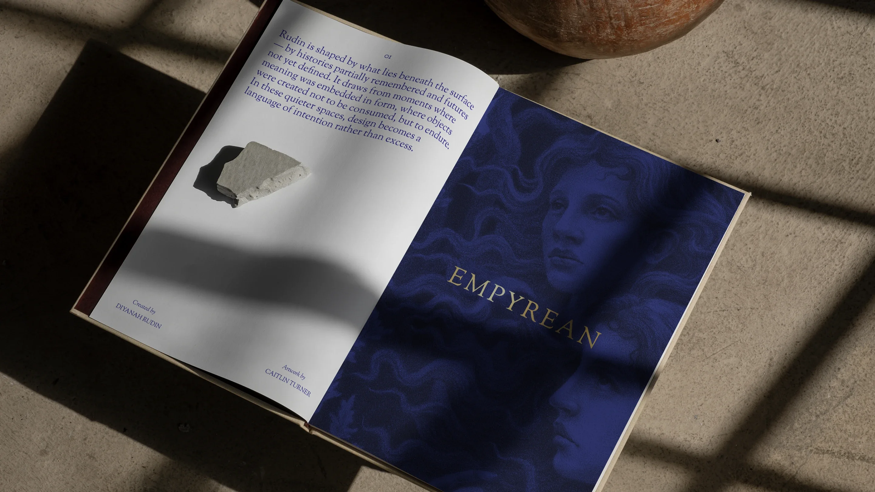 Open Rudin brand book showing editorial layouts and poetry