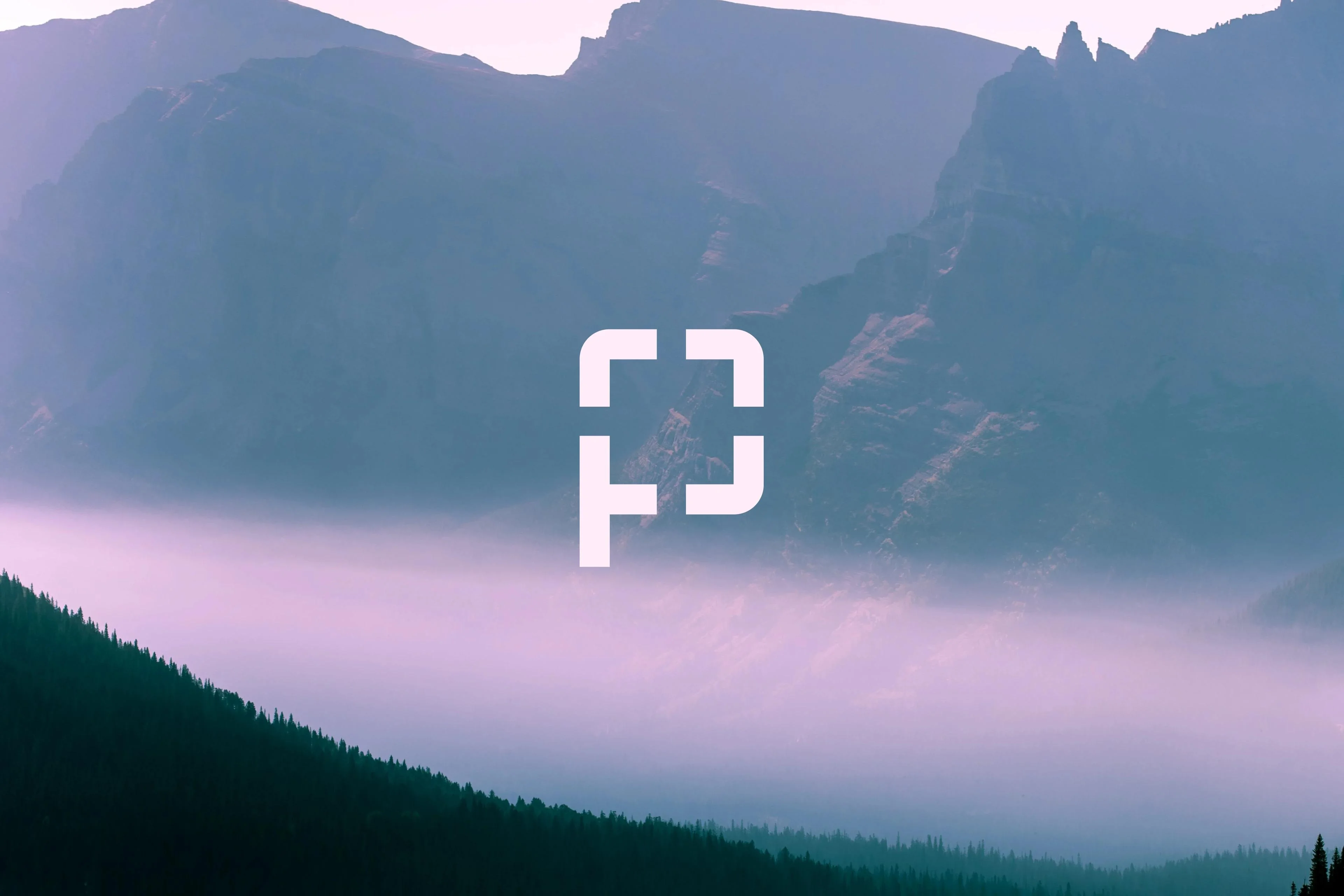 Misty mountains at dawn with a white square frame icon, ideal for photography or showcasing Perfectly Clear image correction.