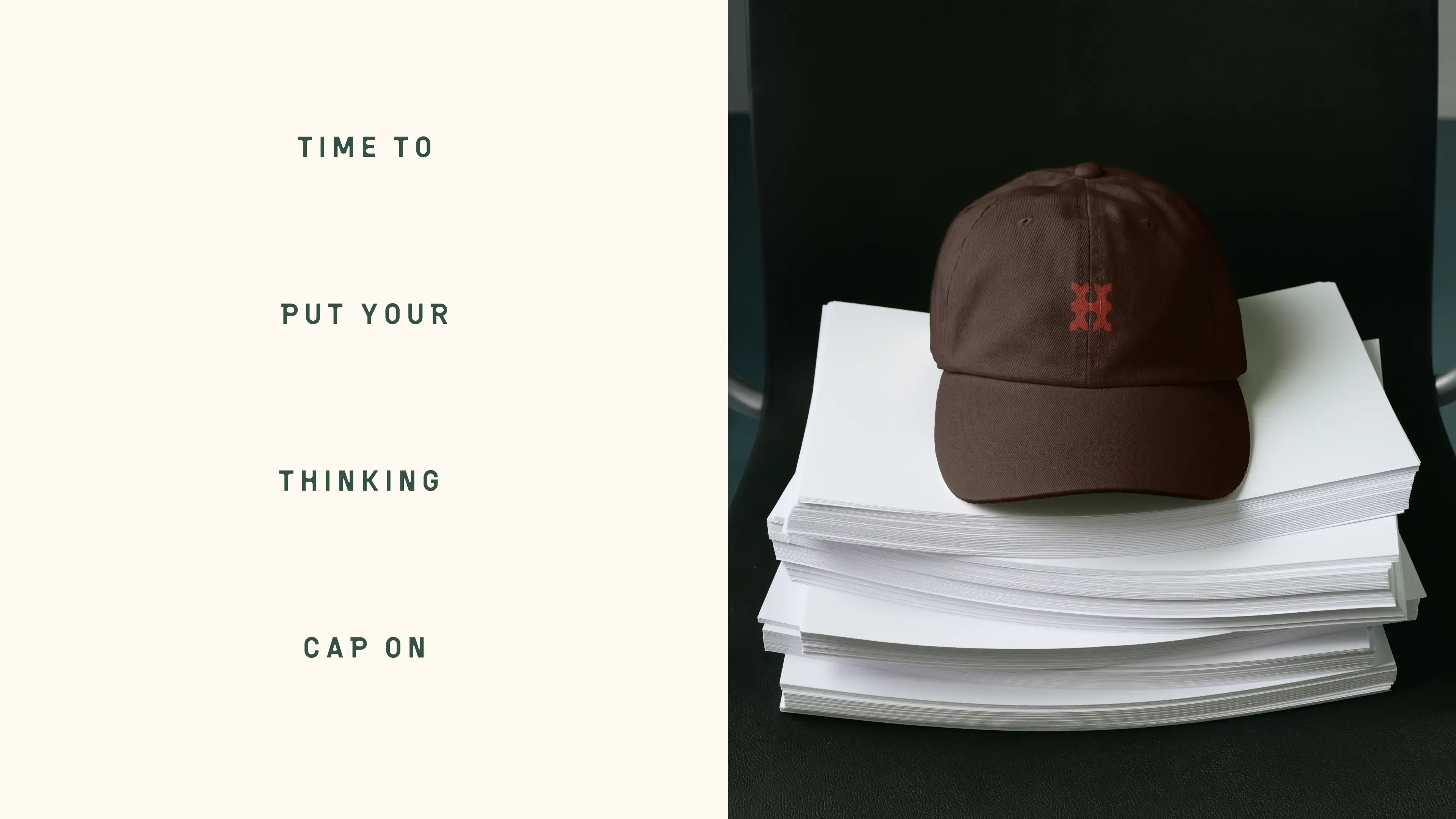 “Time to put your thinking cap on” in spaced green capitals on cream, beside a brown cap embroidered with the red Hutton monogram, resting on a stack of paper