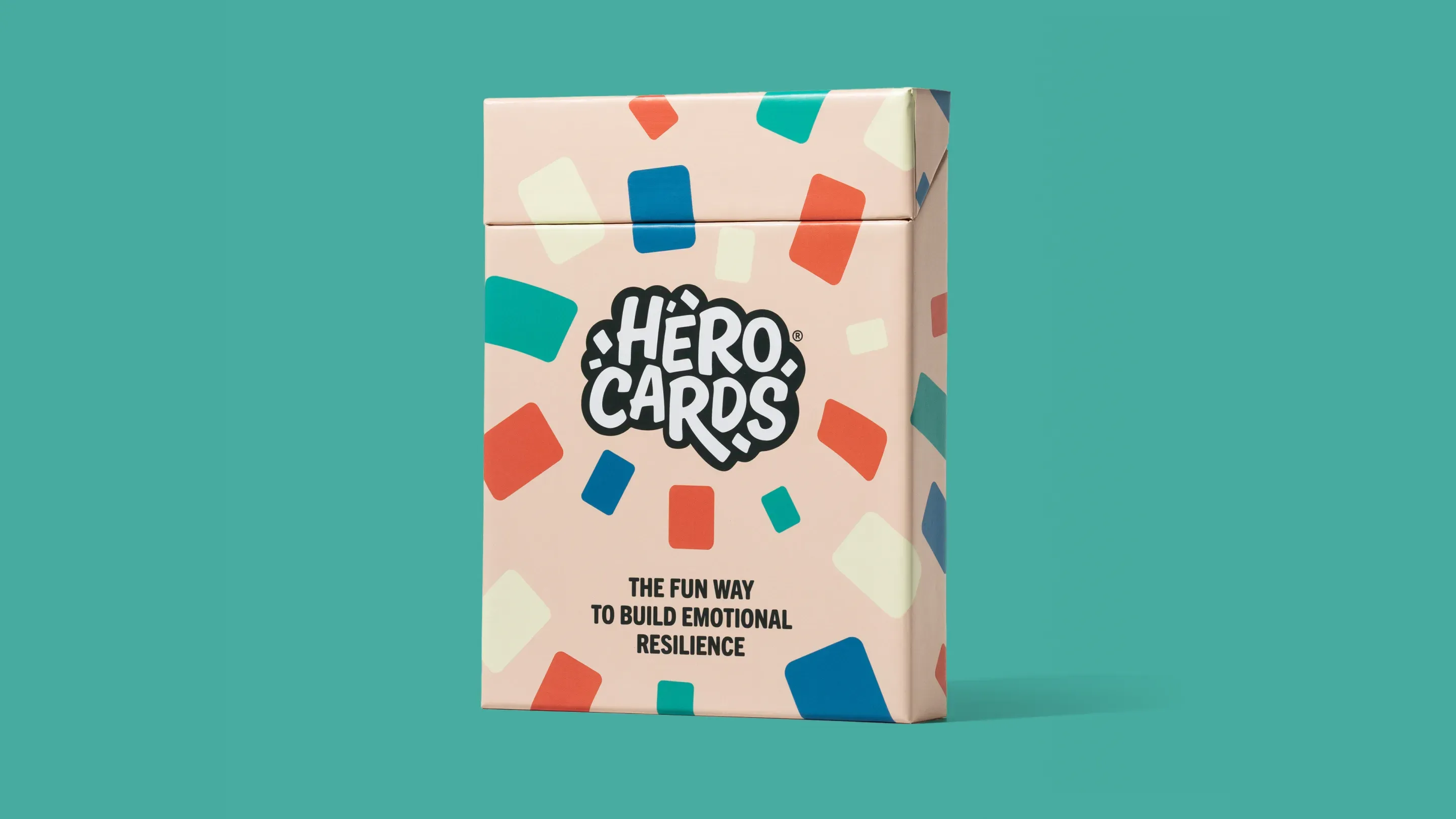 A pastel-colored box labeled Hero Cards showcases eye-catching packaging with colorful rectangular shapes and the tagline The fun way to build emotional resilience on a teal background